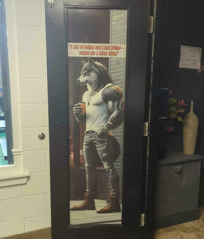 Anthropomorphic wolf character poster on a door, showcasing a cringe fashion style with ripped jeans and a tank top.