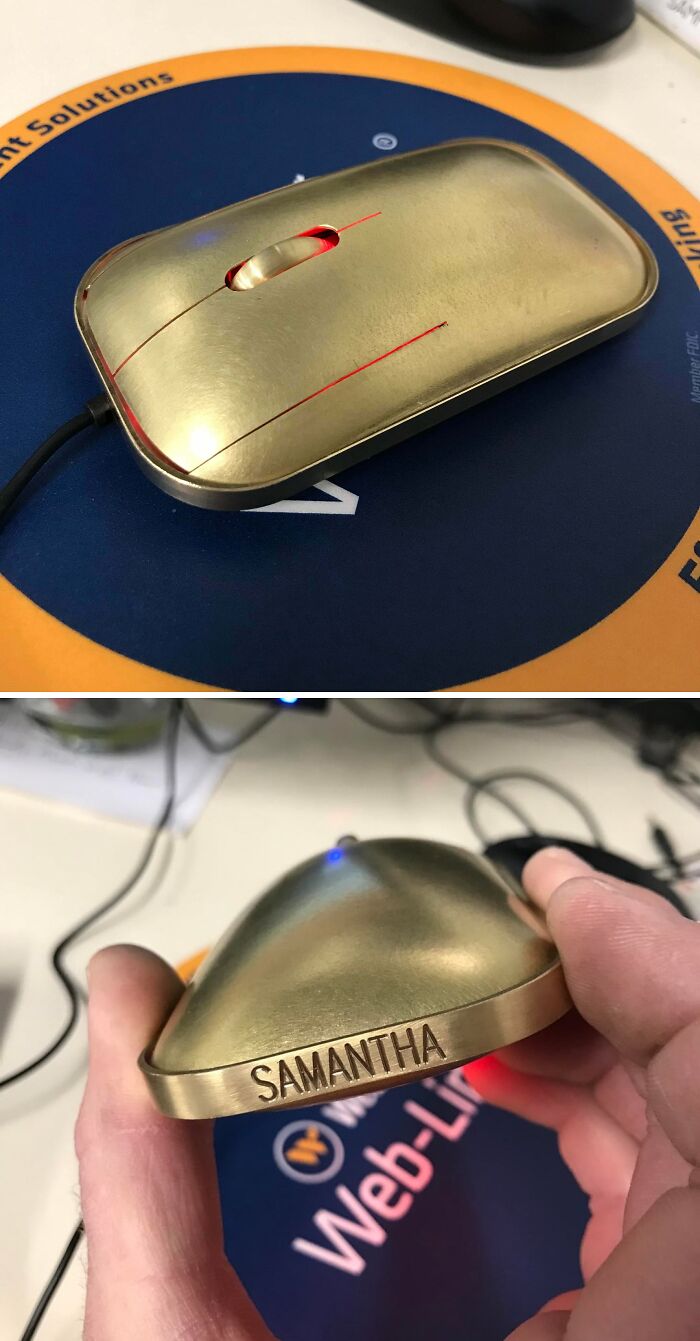 Metalworker-crafted custom brass computer mouse with engraved name showcasing remarkable metalworking skills and design.