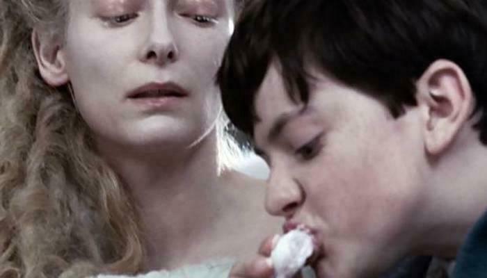 The White Witch watching Edmund eat Turkish Delight, a nonsensical movie detail from Narnia.