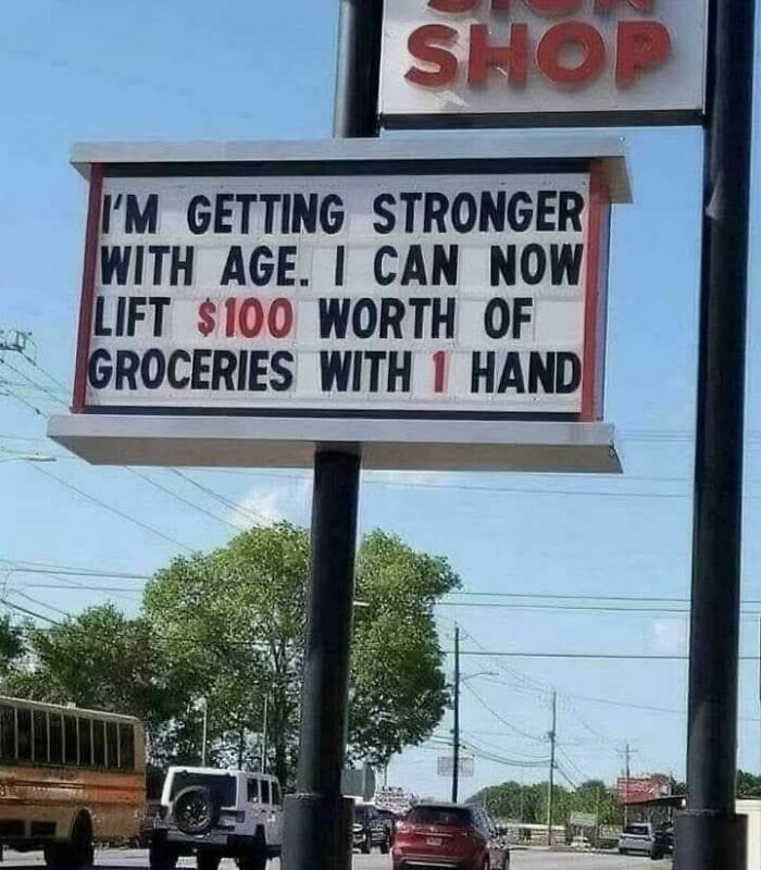 Funny strange sign outside a shop claiming strength with age by lifting $100 worth of groceries with one hand.