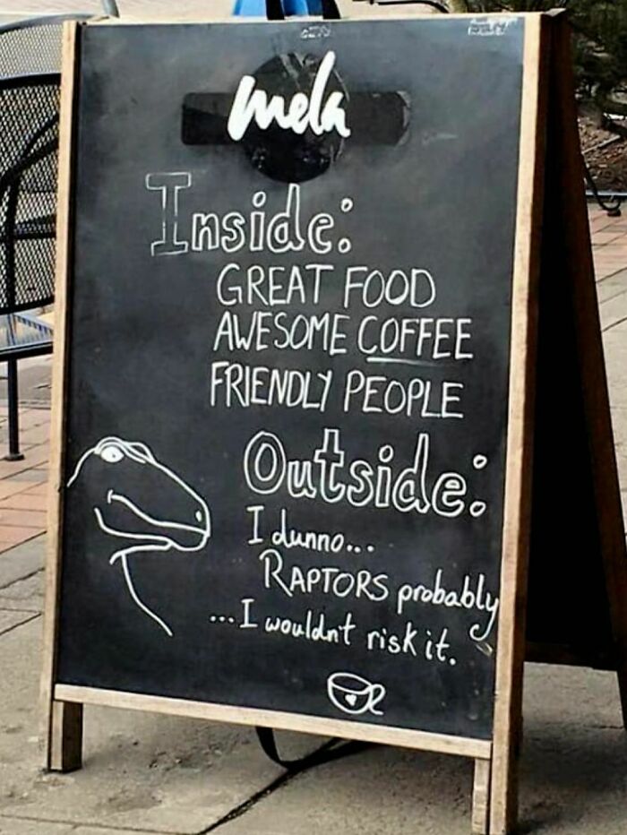 Chalkboard sign with funny message about great food inside and raptors probably outside, a strange sign people notice.
