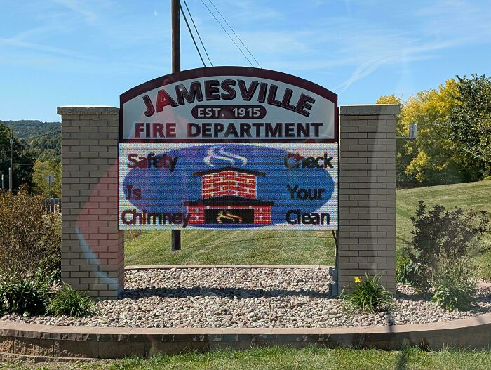 Jamesville Fire Department outdoor sign with digital display showing chimney safety message in daylight setting