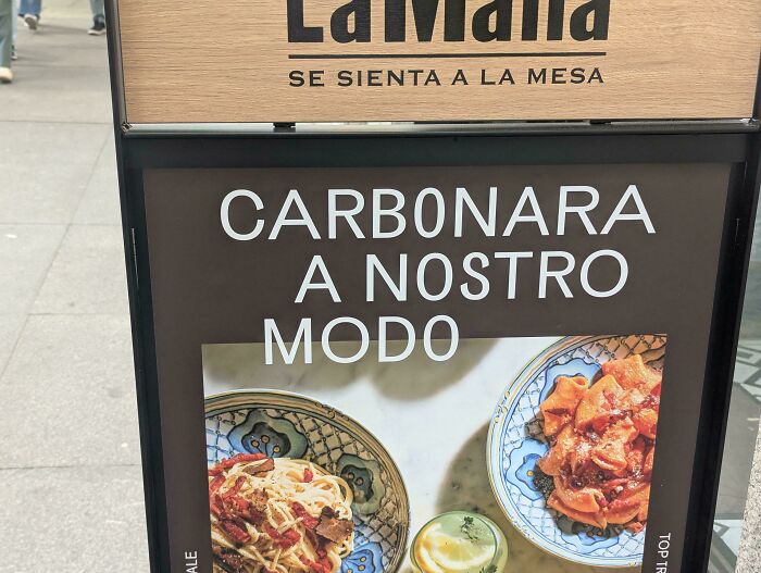 Signboard with poorly designed text layout showing Italian dishes, an example of terrible product designs in public advertising.