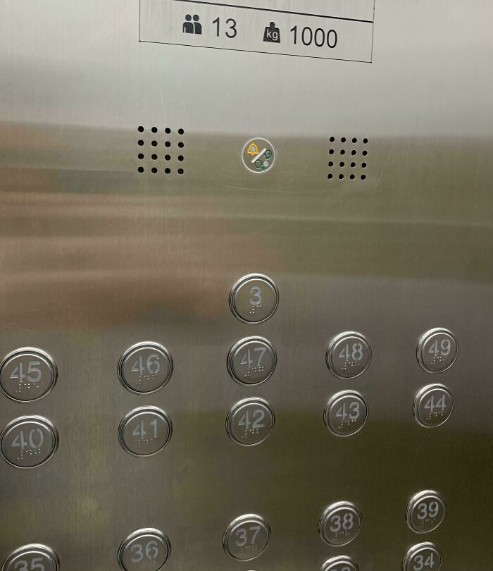 Elevator panel with floor buttons, including an unusual 3rd floor button placed above rows of higher floors, terrible product design.