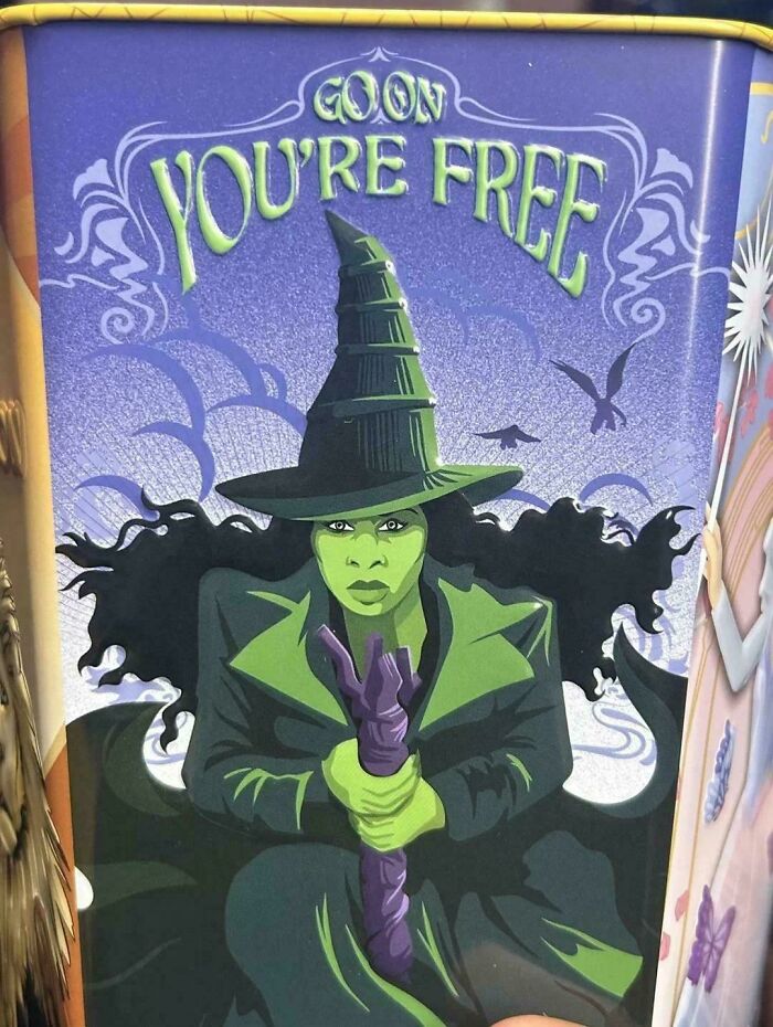 Green witch illustration on a container with the phrase "You're Free," showcasing a terrible product design fail.