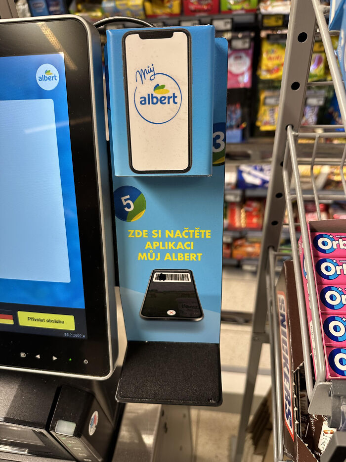 Checkout scanner stand with confusing design causing terrible product design issues in a retail store environment.