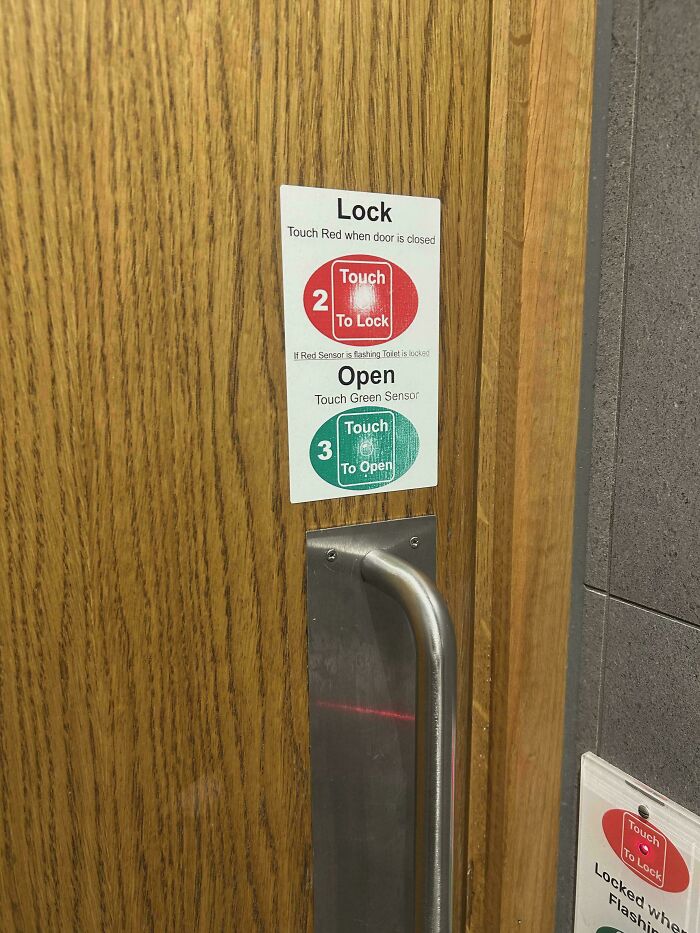 Door with confusing lock and open instructions using red and green touch sensors, illustrating terrible product designs.