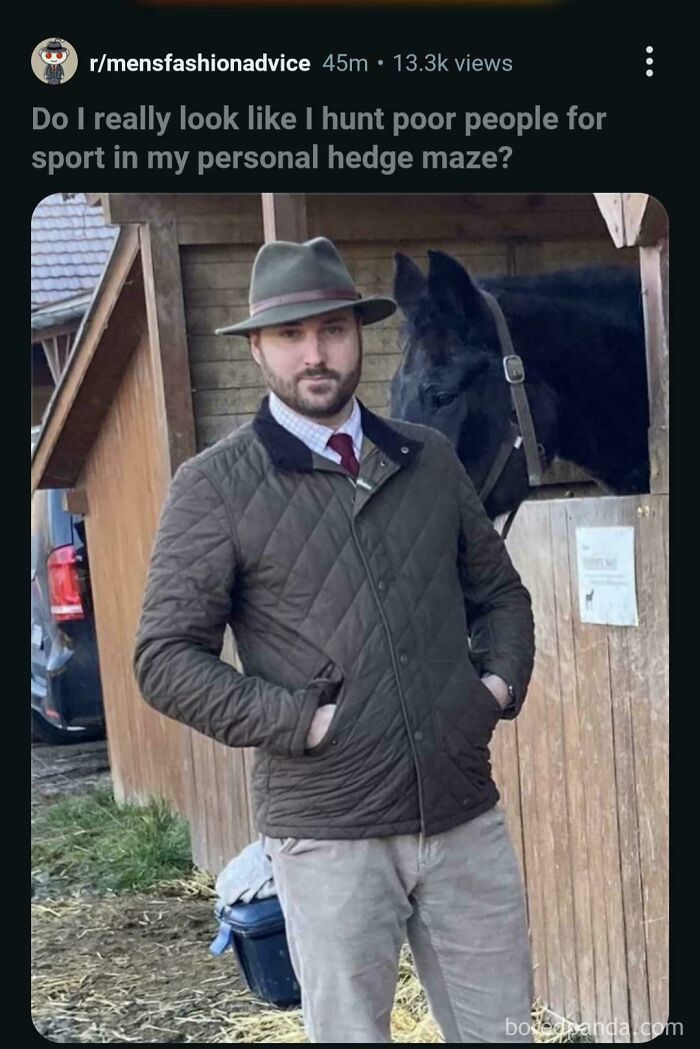 A man in a hat and quilted jacket with a horse in the background, a funny and unpredictable sentence.