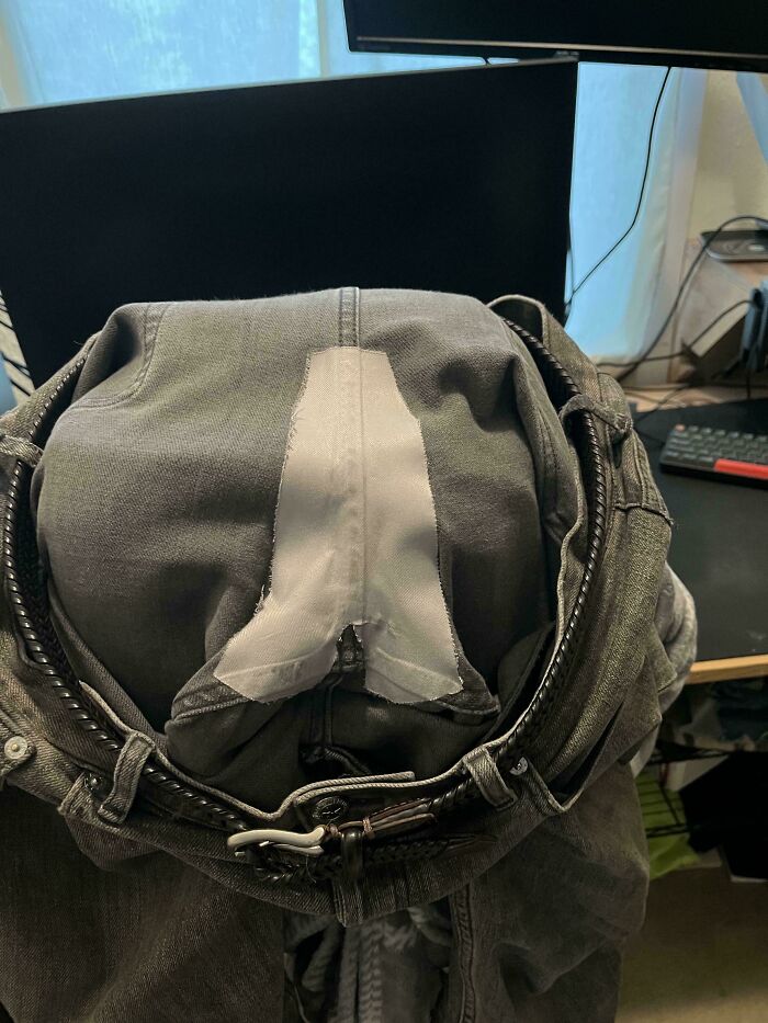 Inside view of dark jeans with a white patch, showing durable repairs. A true Buy It For Life purchase.
