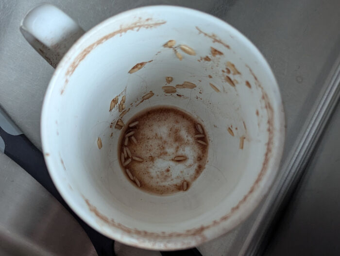 Empty white mug with strange residue at the bottom and sides, one of the strange pics that puzzled people deeply.
