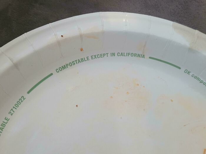 Paper plate with confusing compostable label stating not compostable in California, strange pics capturing odd packaging details.