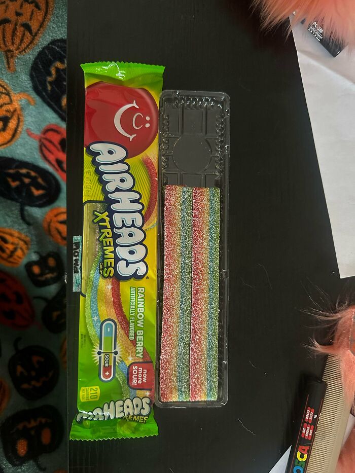 Airheads Xtremes Rainbow Berry candy with noticeably less candy inside packaging showing shrinkflation example.