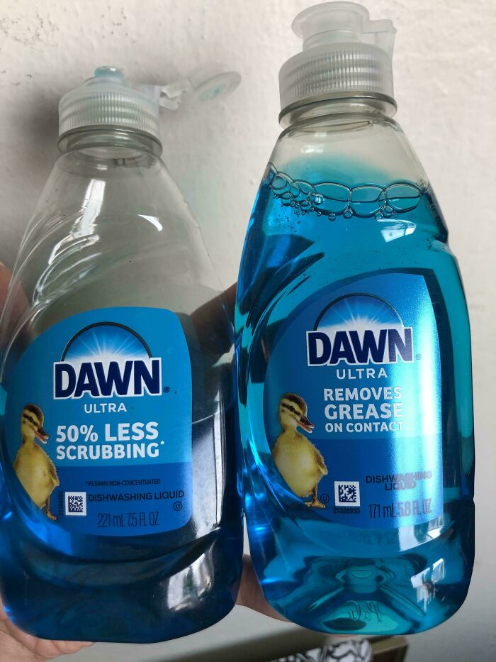 Two bottles of Dawn Ultra dishwashing liquid side by side showing obvious shrinkflation with different sizes and labels.