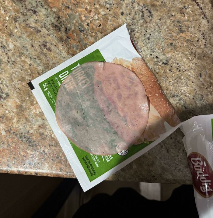 Single slice of turkey deli meat on its original package, illustrating obvious shrinkflation in America products.