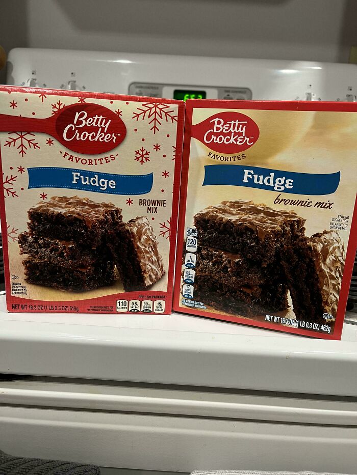 Two Betty Crocker fudge brownie mix boxes side by side showing shrinkflation with smaller net weight on the right box.