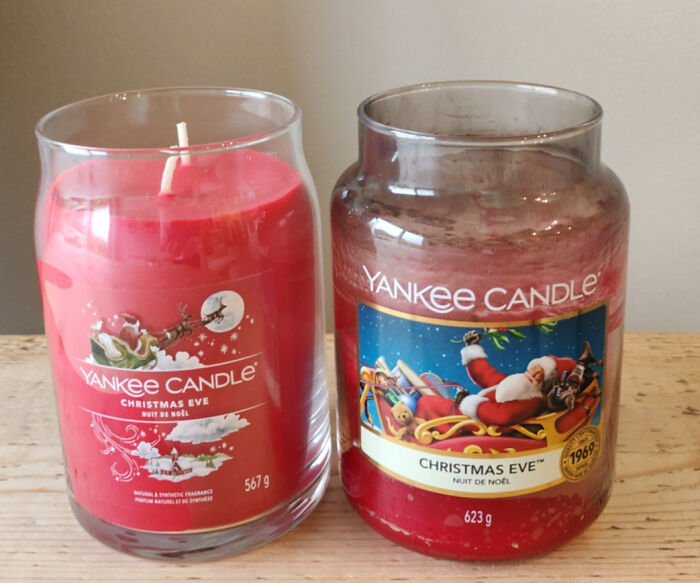 Two Yankee Candle Christmas Eve jars showing obvious shrinkflation with reduced wax amounts in similar containers.