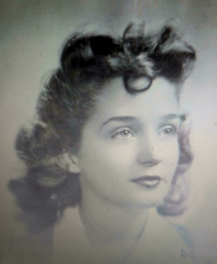 Black and white vintage portrait photo of a woman from decades ago reflecting timeless moments in history.