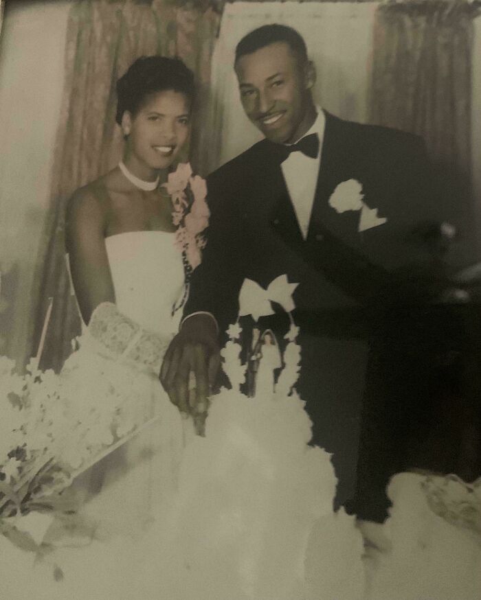 Vintage wedding photo of a happy couple cutting cake capturing moments from decades ago that still resonate today