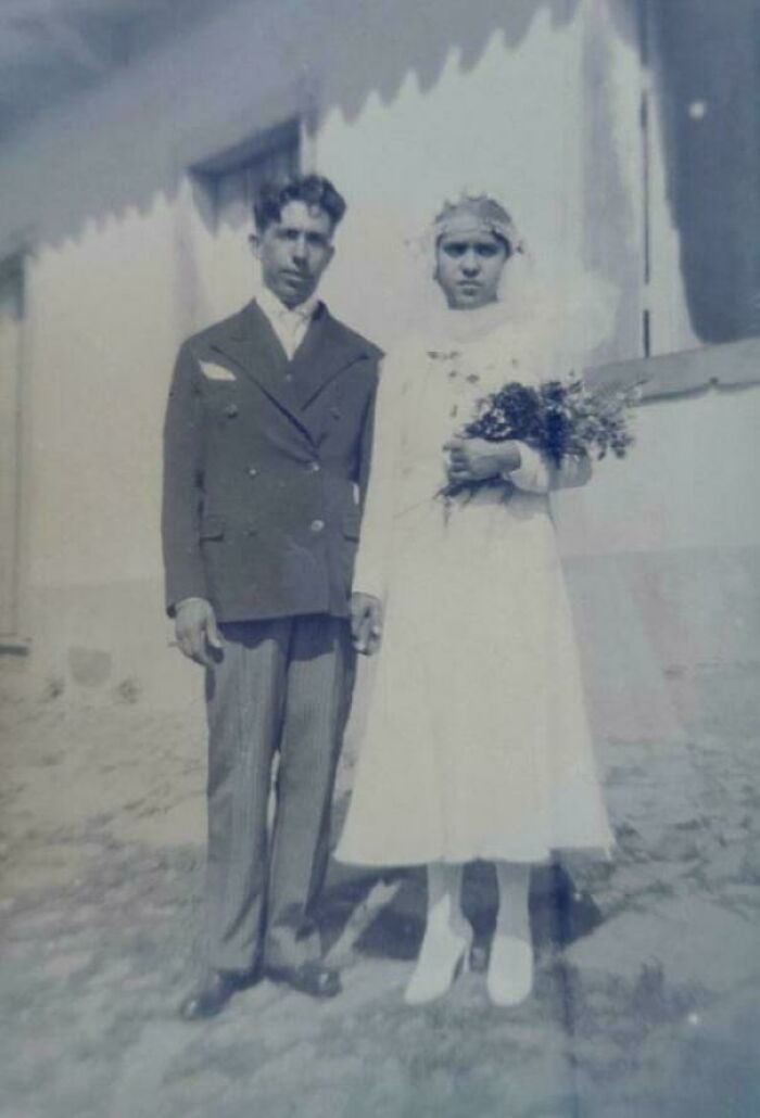 Black and white photo of a couple in vintage wedding attire, representing 109 photos from decades ago with historical significance.