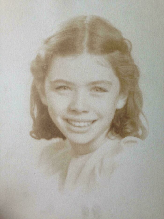 Sepia-toned vintage photo of a smiling young girl from decades ago, capturing a moment that still speaks louder today.