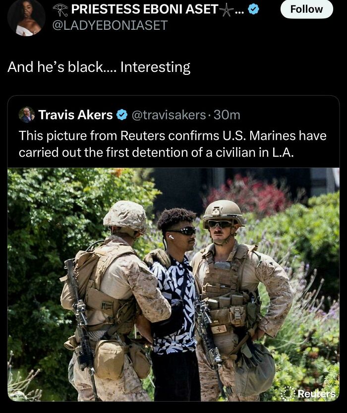 Black Twitter post reacting to a Reuters image showing U.S. Marines detaining a man in casual clothes outdoors.