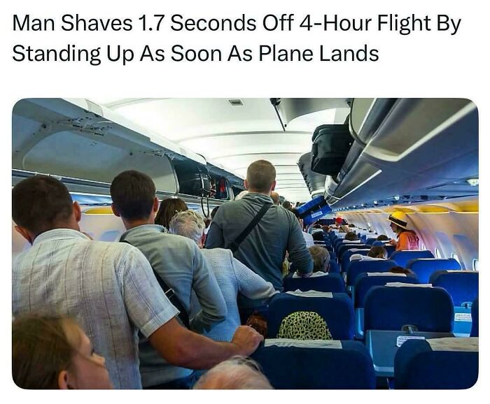 Passengers standing and gathering in airplane aisle preparing to exit, capturing a popular internet moment better than the news.