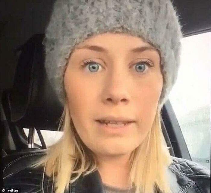 A woman with blonde hair and blue eyes, wearing a gray beanie, showing entitlement and Karen reputation.