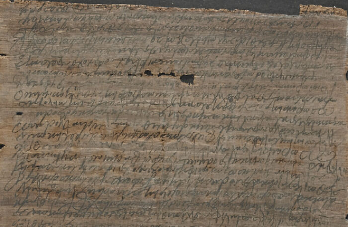 Ancient handwritten artefact on worn parchment, showcasing historical script that reveals perspectives of past humanity.
