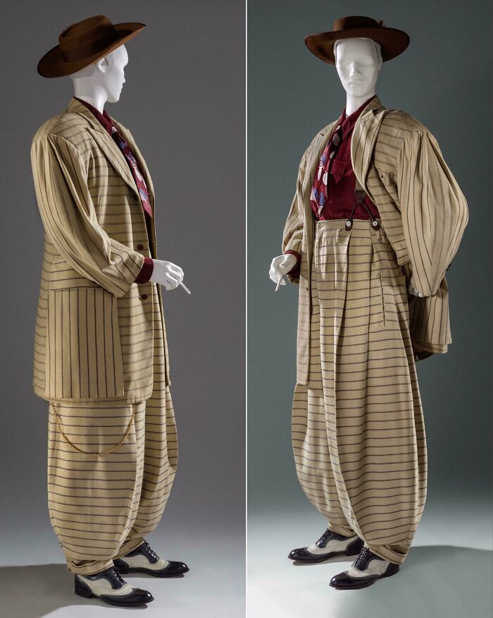 Vintage striped suit and hat displayed on mannequin, showcasing fascinating artefacts that survived to this day for perspective.