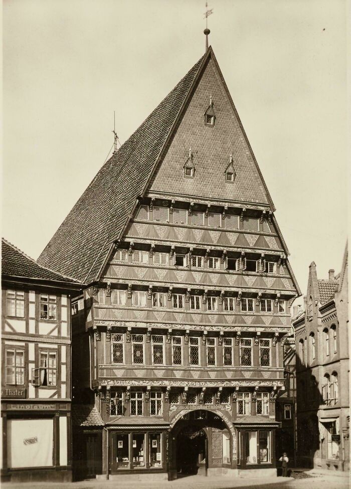 Historic artefact of medieval timber-framed building with intricate patterns and steep roof surviving to this day.