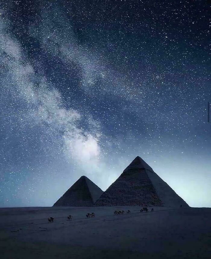 Pyramids under a star-filled night sky showcasing strange Earth wonders that are borderline unbelievable.