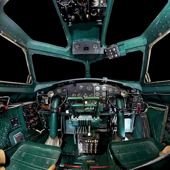 Vintage aircraft cockpit with detailed controls and instruments representing historical photos of a vastly different world.