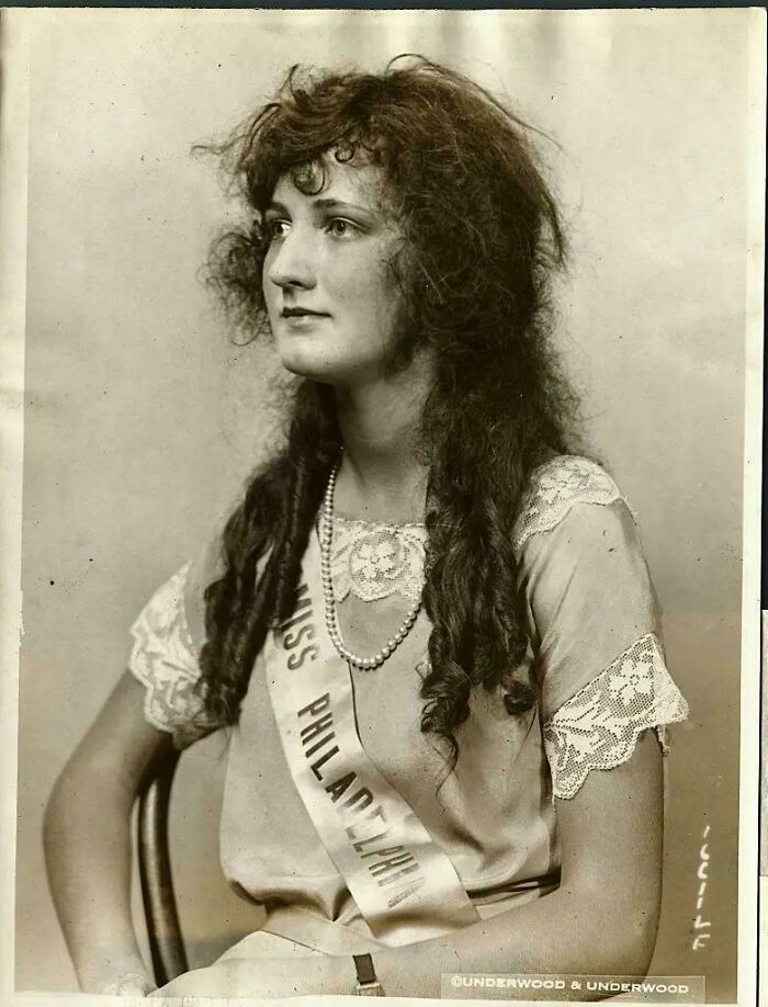 Vintage black and white photo of a young woman wearing a Miss Philadelphia sash representing historical photos.