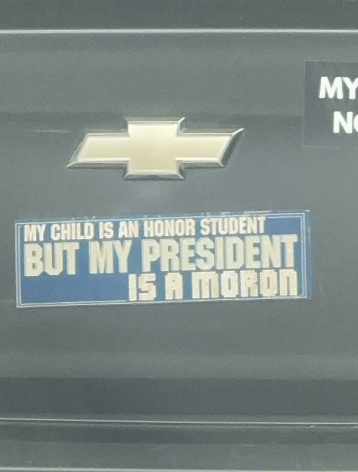 Blue bumper sticker on a Chevy with a humorous political statement spotted among hilarious and unhinged bumper stickers.