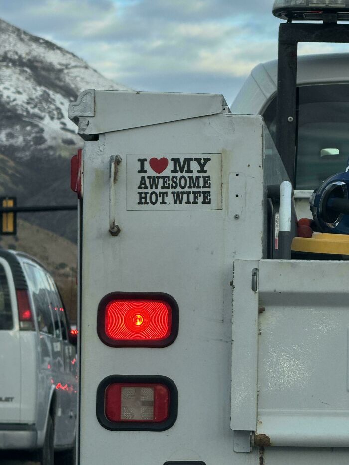 Bumper sticker on white truck saying I love my awesome hot wife, one of the most hilarious and unhinged bumper stickers spotted