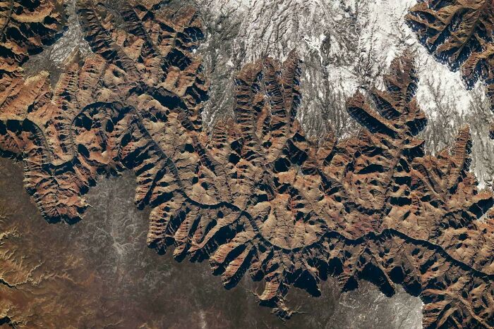 A satellite view of rugged mountainous terrain with deep valleys creating a misleading and confusing photo effect.