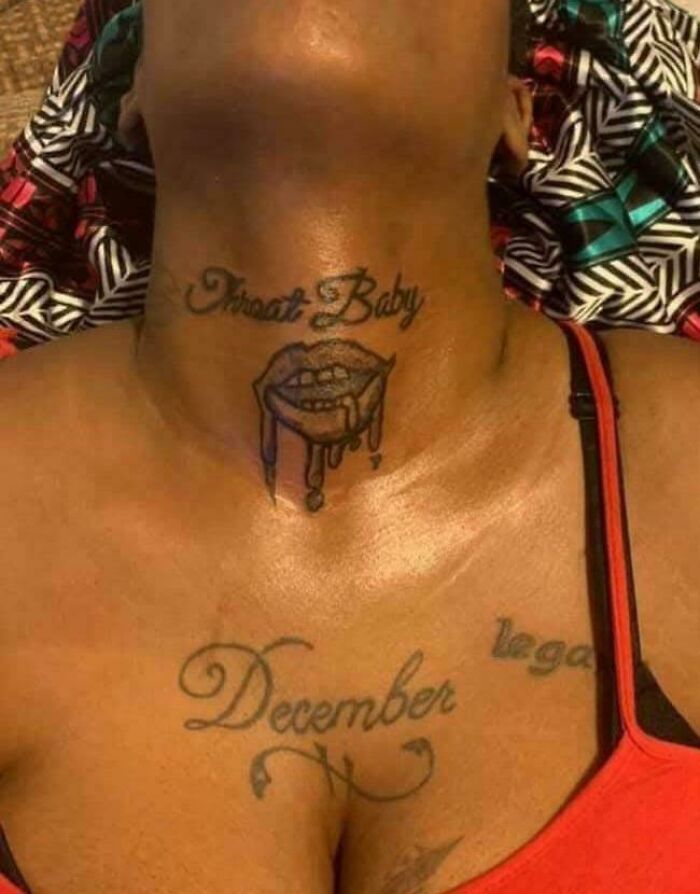 Neck tattoo with dripping lips and text above, showcasing one of the truly awful tattoos that are funny and tragic.