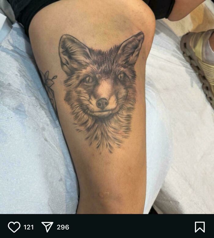 Realistic fox tattoo on thigh, showcasing detailed shading and fur texture in truly awful tattoos collection.