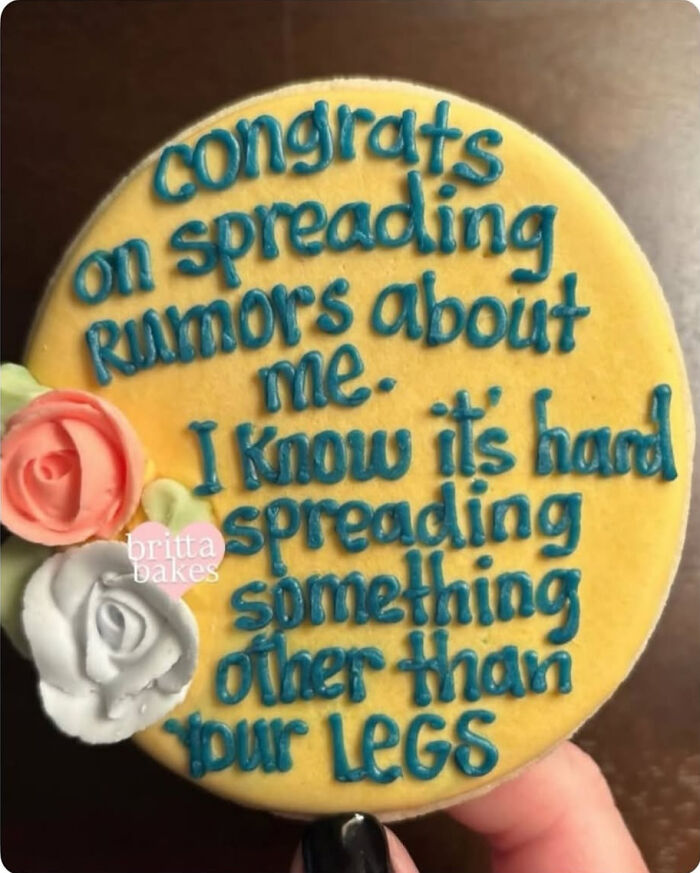 A decorated cookie with a savage verbal knockout message about spreading rumors.