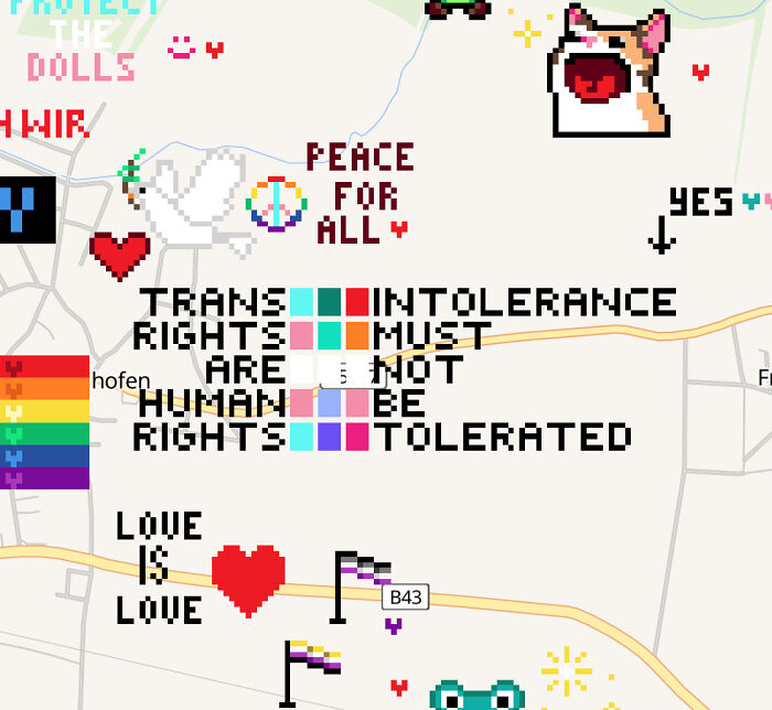 A hilariously confusing message from poor sign design with text 'TRANS INTOLERANCE RIGHTS MUST ARE NOT HUMAN BE RIGHTS TOLERATED.'