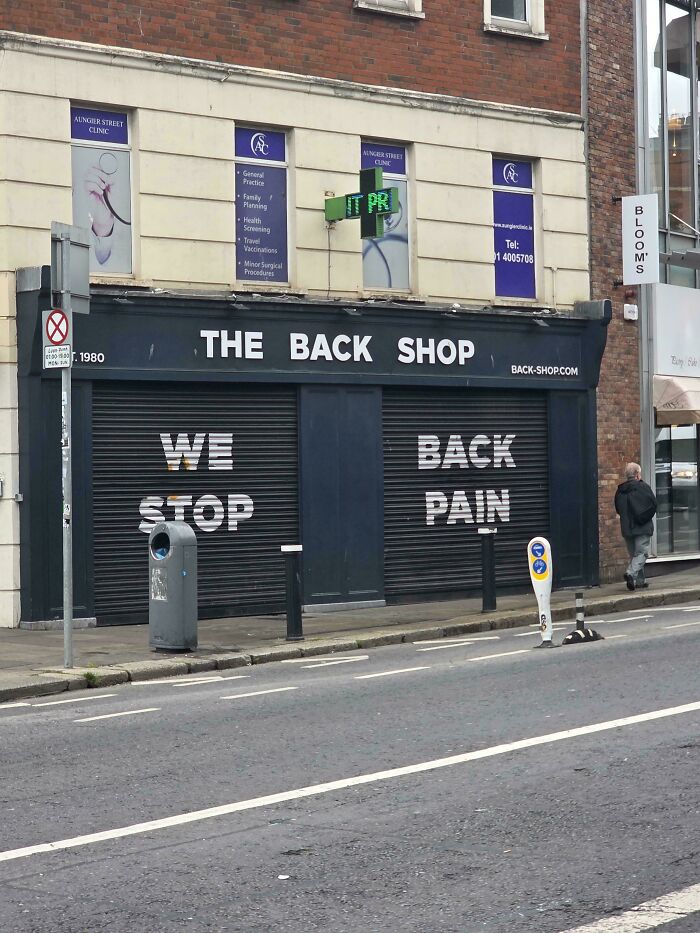 A hilariously confusing message from poor sign design with a shop front sign reading 'THE BACK SHOP WE BACK STOP PAIN'.