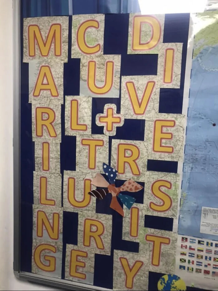 A hilariously confusing message from poor sign design with letters that read 'MC DI AU VE RL +E RI TR IL UY S N IT R GEY.'