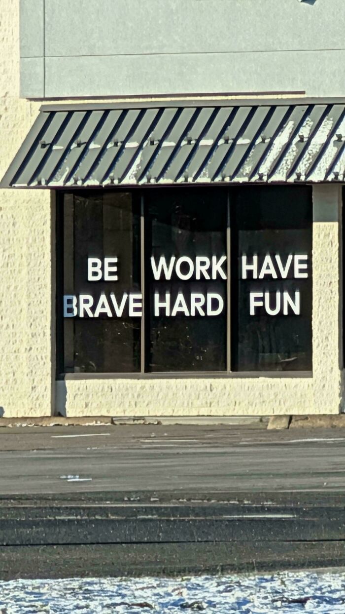 A sign design creating a confusing message: Be Work Have Brave Hard Fun.