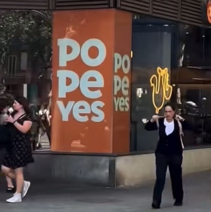 A poorly designed Popeyes sign with text PO PE YES displayed vertically, creating a confusing message.