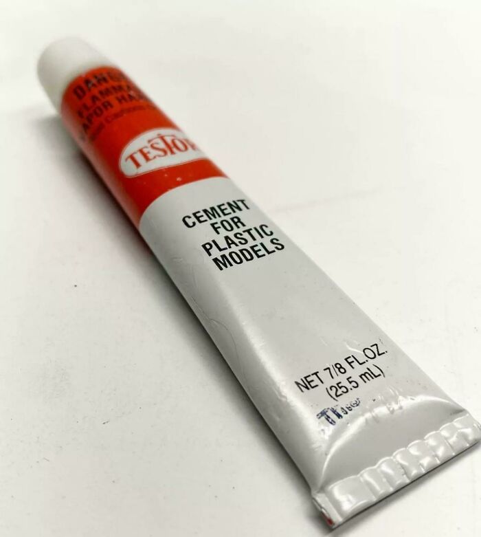 Tube of Testors cement for plastic models, a nostalgic crafting supply from past decades.
