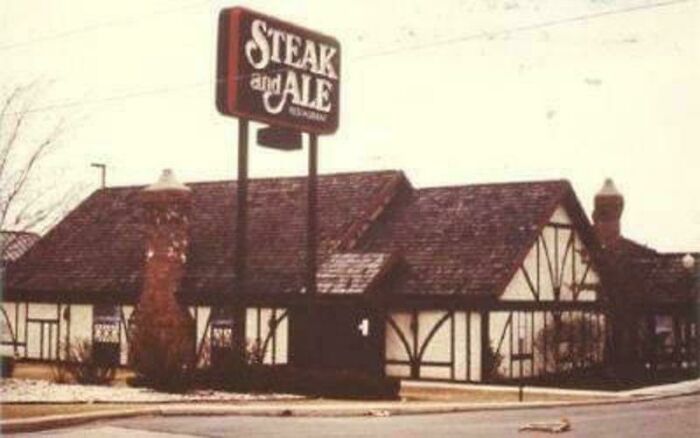Steak and Ale restaurant exterior with nostalgic architecture and vintage sign in a quiet street setting.