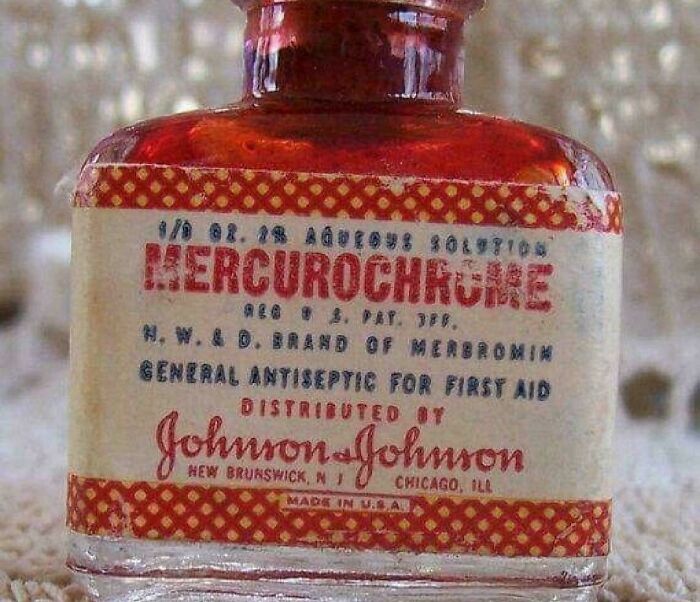Vintage Mercurochrome antiseptic bottle with Johnson & Johnson branding, a nostalgic reference to old first aid products.