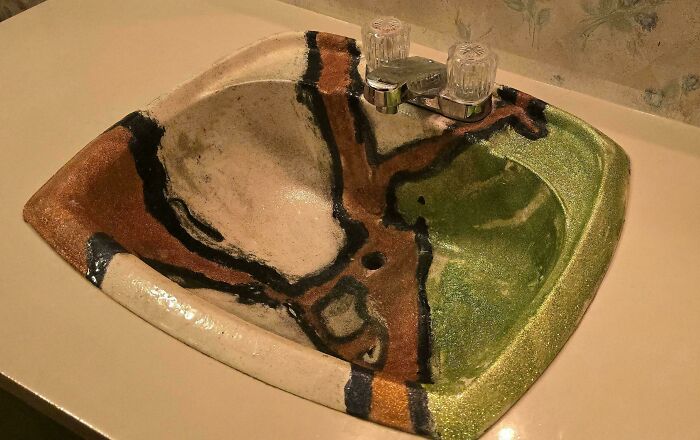 A colorful, unconventional DiWHY sink with brown, black, white, and green patterns, highlighting a DIY project that failed.