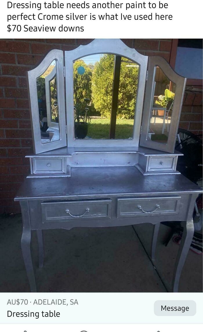 A silver-painted dressing table with a three-panel mirror, a good example of DiWHY furniture.