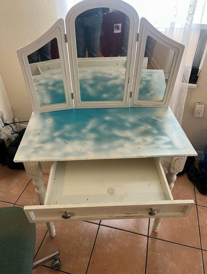 DiWHY: A vanity with a painted turquoise tabletop and a drawer pulled out, illustrating a DIY project.